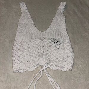 woman’s white knit top